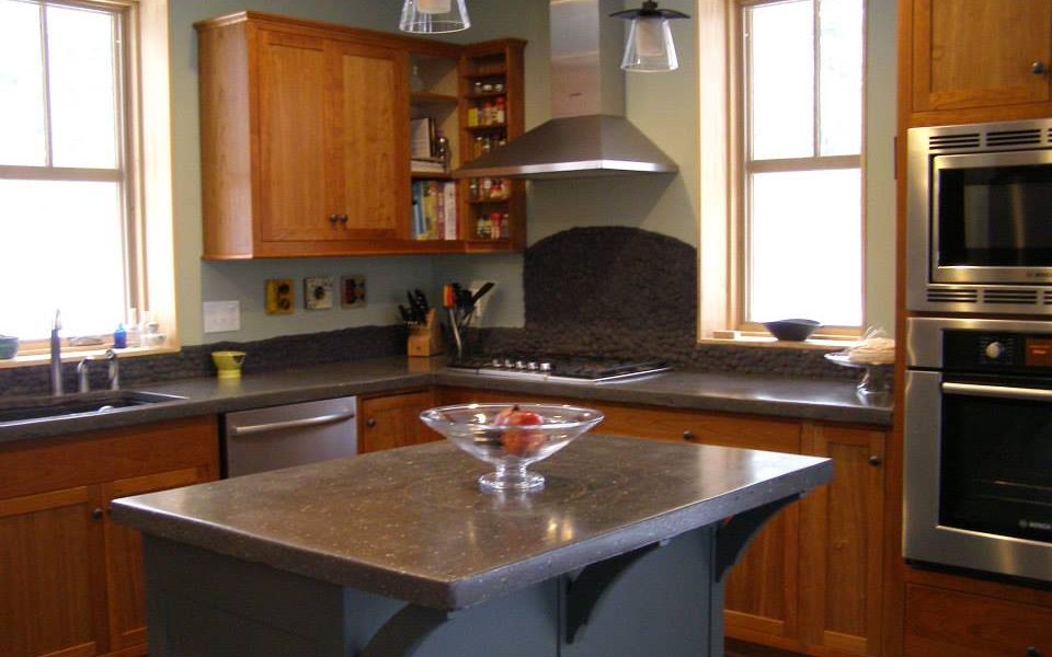 A painted island is a great way to lend some contrast to a warm cherry kitchen.