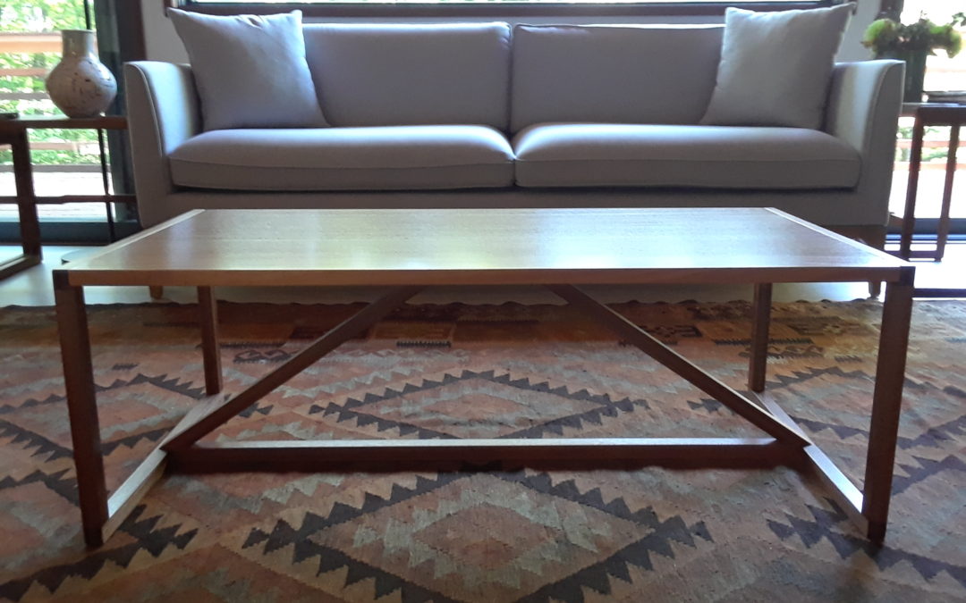 A slender, modernist mahogany coffee table.